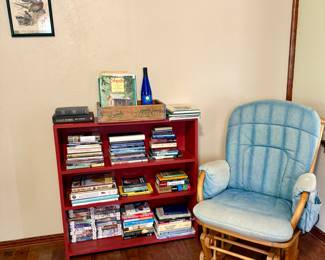 Glider chair, book shelf and books