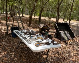Various old tools and wagon cart which can be pulled behind a mower/tractor