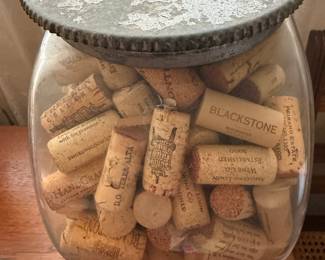 Old penny candy jar full of corks