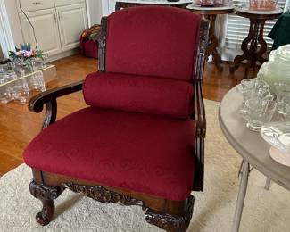 Red Armchair with carved wood legs and arms