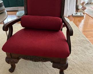 Red Armchair with carved wood legs and arms