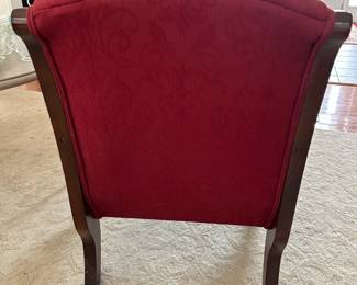 Red Armchair with carved wood legs and arms