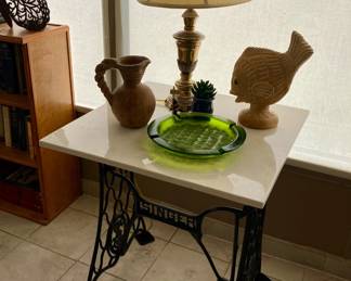 Notice Singer sewing machine legs on the table