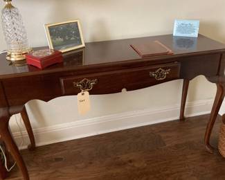 Narrow table with scroll legs