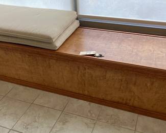 Long storage cabinet with custom fitted seat cushions