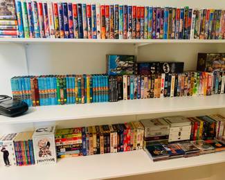 closet filled with Disney movies, early Hardy Boy book collection and CDs