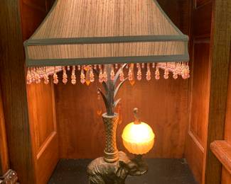pair of elephant table lamps with lighted glass balls