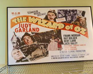 the home theater features a few framed movie posters including this one