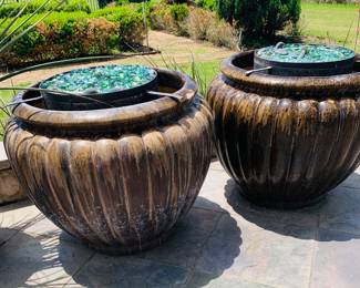 this is a pair of "Fire and Ice" large pots--they can be attached to gas and fire shoots out of the crushed glass--perfect around pools, patios, or gardens