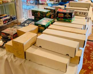 43 boxes of sports card and several more notebooks filled