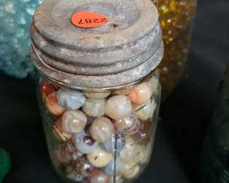 GLASS JAR WITH MARBLES