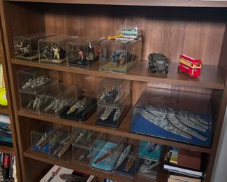 Many model airplanes, some in cases but most are not