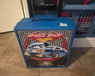 Cars inside including a bin full of cars as well