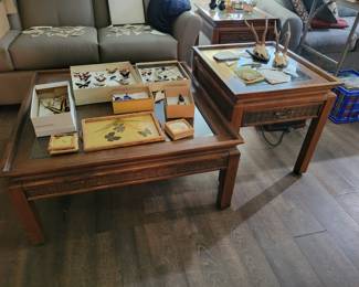 Beautiful wooden end tables and coffee table with Wicker and glass tops.