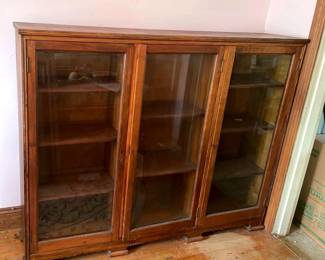Antique wood cabinet with glass fronts