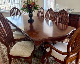 Beautiful Dining Room Table and Eight Chairs. Two Leaves. All upholstery looks great. Only one chair has small grey smudges which probably can be removed. Also, one small water stain on table top of table. $500