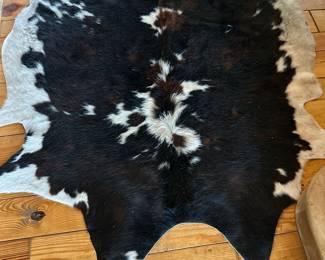 Several Cowhide Rugs