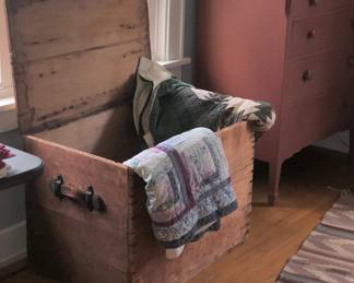 Another Victorian blanket chest with vintage quilts.
