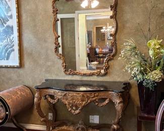 French console with black marble top, gold gilt framed mirror.