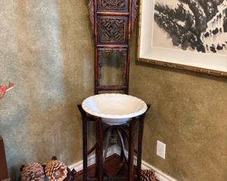 Chinese carved wood washstand with porcelain bowl.