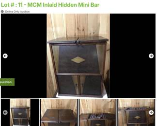 Lot # : 11 - MCM Inlaid Hidden Mini Bar
Top is divided to open, raise and reveal a decanter and drinking glasses and measures 31 1/2" x 13" x 27" tall. No decanter but glasses are included