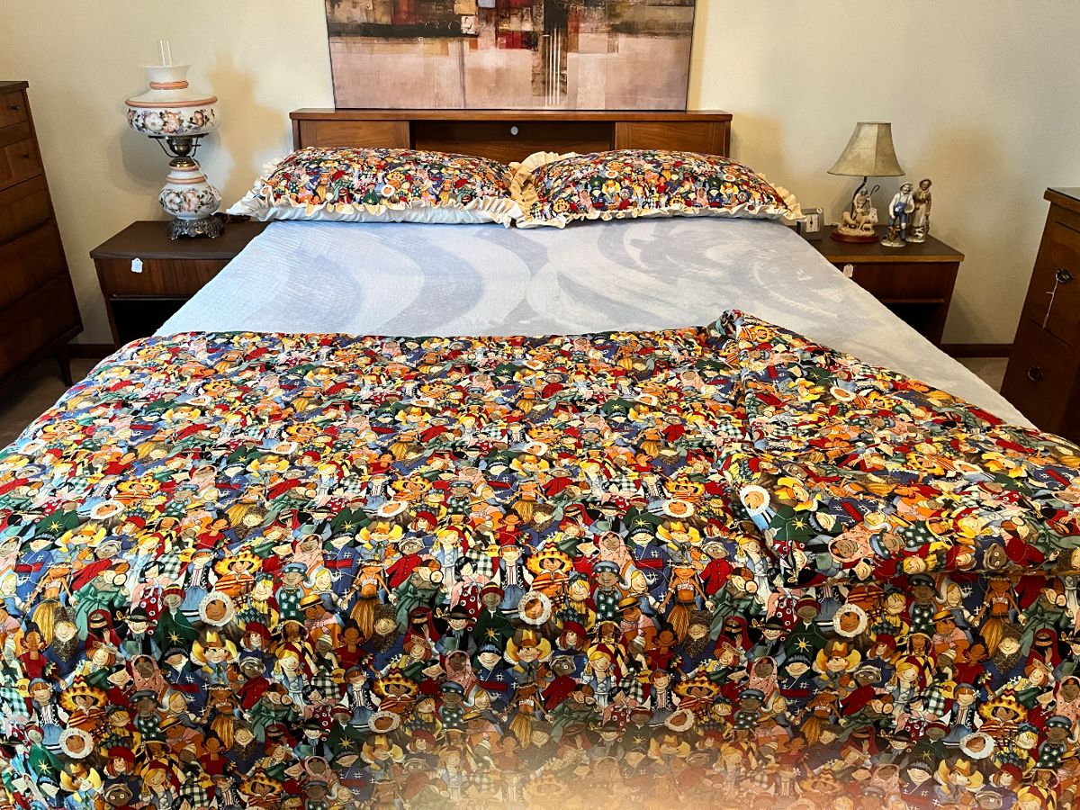 Mid-Century headboard and nice mattress. Comforter is handmade!