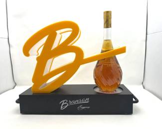 Branson Cognac Bottle featured with a vibrant light-up display stand. (Cord Missing)