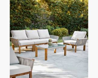 Modern and Sophisticated Patio Set- Acacia Wood and Woven w/ Rope-Acacia wood frames with weather-resistant rope accents includes: Glass-top coffee table, two arm chairs and a three piece couch.