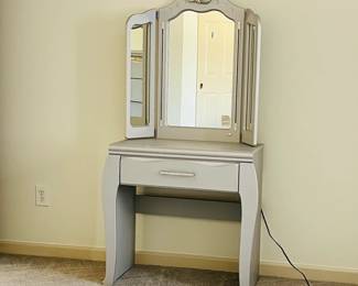 Fit for a princess. The Zarollina vanity and mirror set is glitzy and glamorous—perfect for the ultimate girly girl. The finish is accented by pearlized faux crocodile skin detailing. Shapely scrolling provides fanciful flair, while tri-fold mirror with LED lighting casts soft glow.