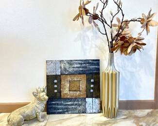 Decor Set Featuring Modern Painting and Silver Decor.