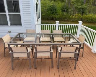 Brown Jordan outdoor table with 8 Swim chairs. Table is 99"x45" and Chairs are 23" x 24". Excellent like new condition. Umbrella hole in middle. Umbrella with weighted base listed separately.