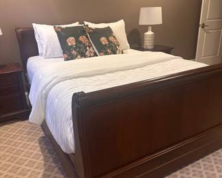 Stanley Furniture Queen sleigh bed in solid walnut.