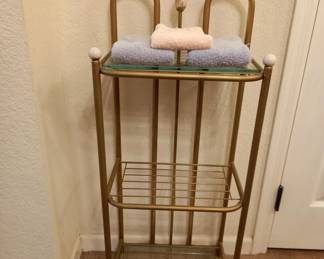 Metal bathroom storage rack with cushioned seat