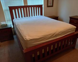 Queen size bed with wooden slat headboard and frame