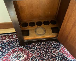 bottom cabinet view with bottle wells.