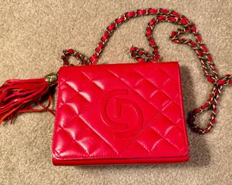 Red Quilted Handbag with Gold Chain Strap and Tassel