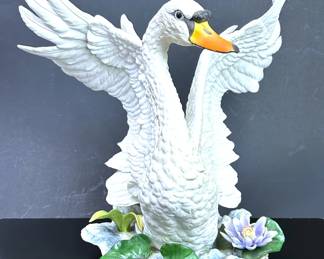 Large Limited Edition Boehm Porcelain Male Mute Swan. Boehm Studios was founded by Edward Marshall Boehm (1913 -1969) a ‘naturalist farmer’ in 1950.  The Boehm legacy was carried on by his wife and business partner, Helen Boehm after his passing.  Based in Trenton New Jersy, Boehm Porcelain built up a reputation for remarkable porcelain sculpture art.  Boehm’s reputation excelled after the Metropolitan Museum of Art purchased his first sculptures.   His work was purchased by President and Mrs. Eisenhower to present Boehm porcelain as gifts for visiting Heads of State.   This culminated in Boehm receiving a commission to create ‘Prince Philip on His Polo Pony’.  It was presented to Queen Elizabeth and Prince Phillippe in 1957.  Since then, the Royal Family have acquired several examples of Boehm porcelain.    .....To register so you can place bids go to www.capitolsalesservices.hibid.com  
