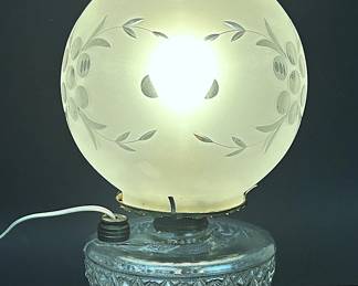 Antique Bradley & Hubbard oil lamp that has been converted to electricity.   This was the kind that sat on an iron call wall mount.  