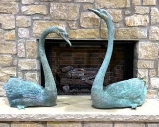 A pair of very large bronze garden fountain swans