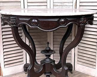 Antique Victorian parlor table of the 1870s