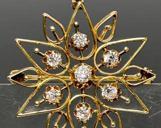Diamonds & 14k Yellow Gold Brooch Pendant. There are seven round cut natural diamonds which have been graded as F-G in color and VS2--SI1 in clarity.