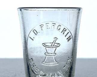 Antique small glass measuring cup from Sherman, TX