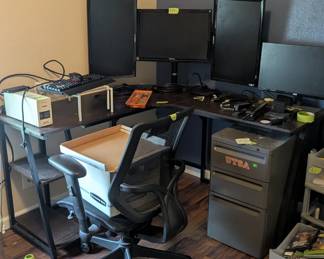 Computer desk, chairs and monitors