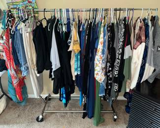 RACK FULL OF WOMEN'S CLOTHING
