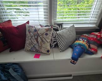 Deorative Pillows galore!! Most are feather filled. Lots of stuffed animal pillows too!