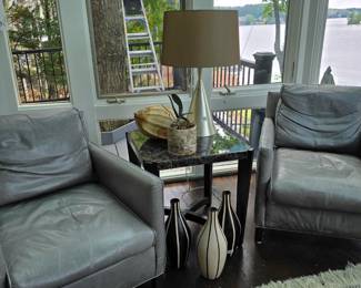 Matching pair of leather chairs.