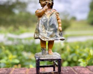 "Girl on Stool" by Juan Clara Ayats bronze with cold paint