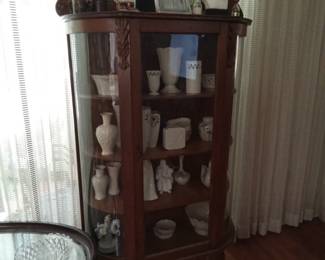 Nice curved glass vintage hutch filled with Lenox!