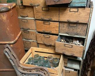 vintage storage filled with doorknobs and hardware
