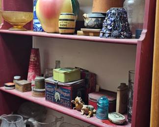 bookcases and advertising tins